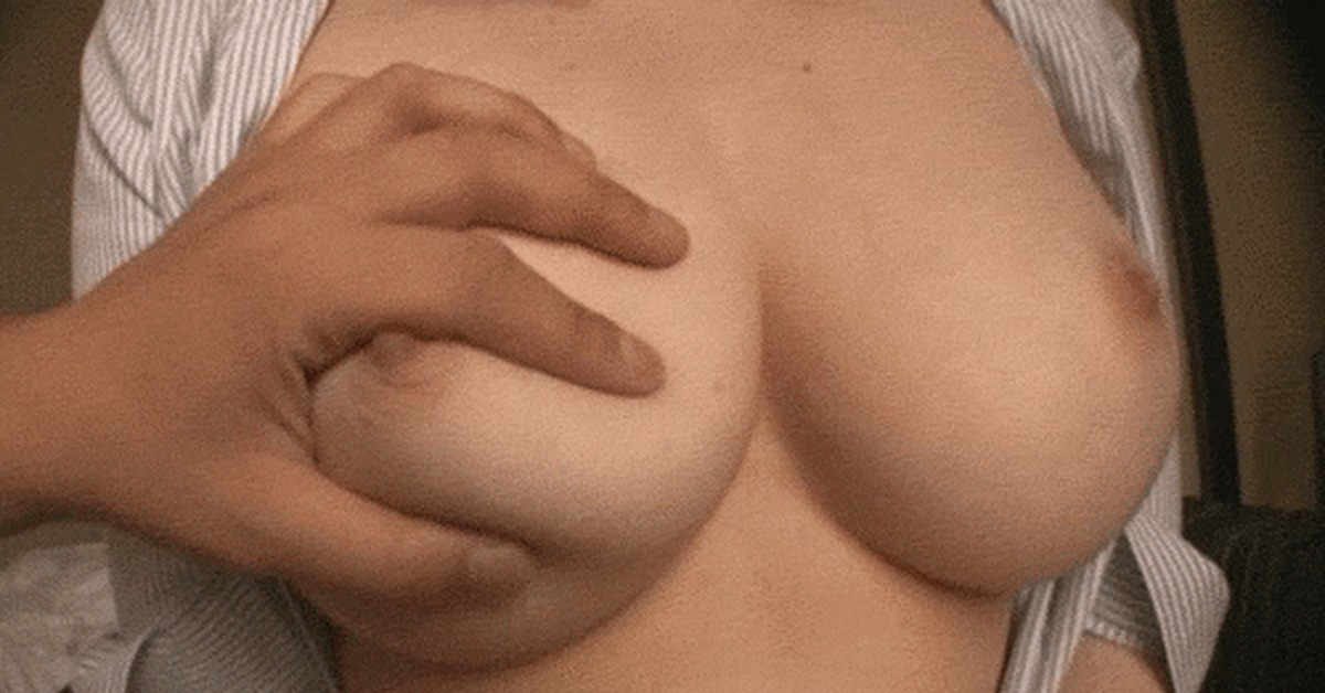 Девушка трогает свою грудь и соски гиф