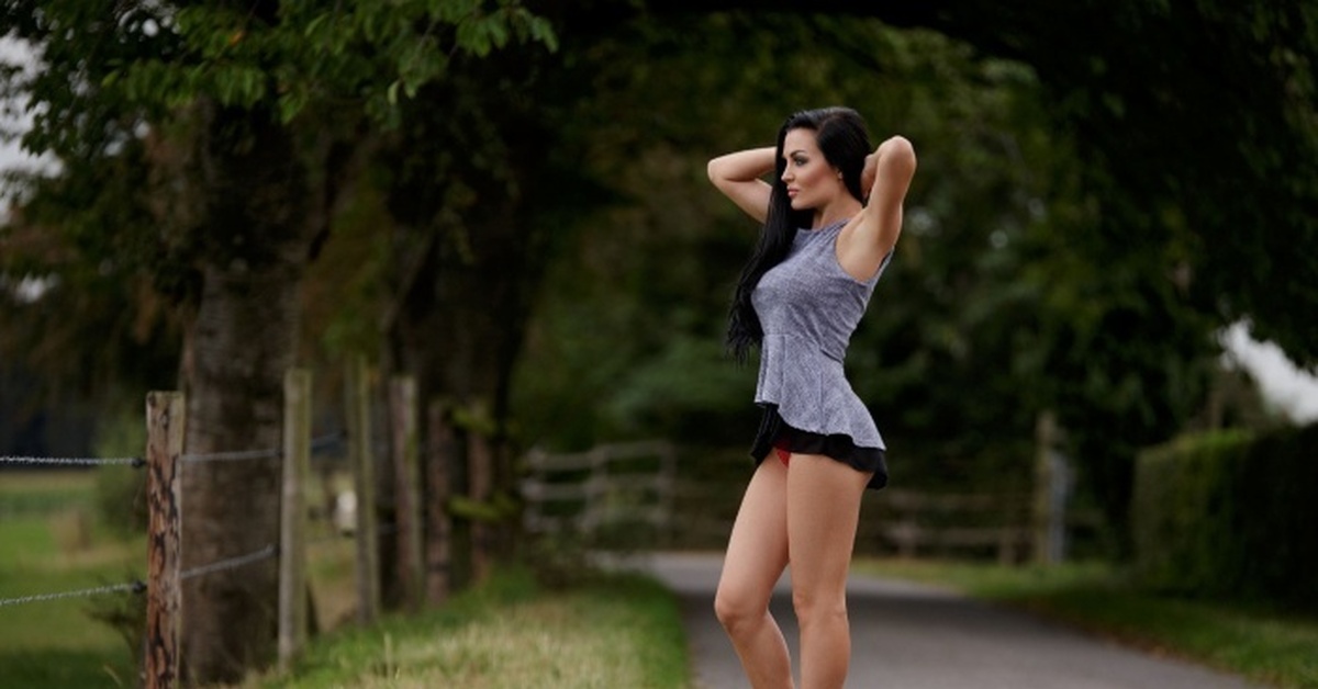Watching outdoor bending brunette