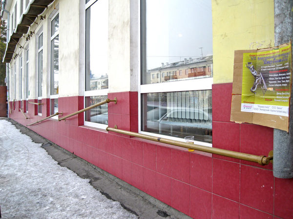 The task of the first handrail seems to be clear - to keep a glass of beer from falling. Why the other handrails? - Mystery, Handrail, Building, Question