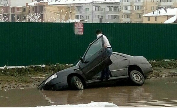 In Krasnodar, the driver did not notice the pit due to a huge puddle.. - Puddle, Krasnodar, Pit
