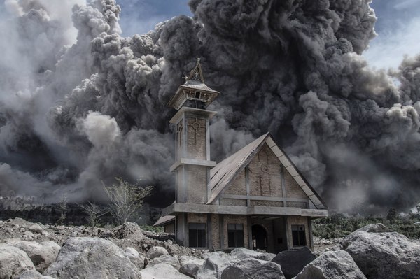 Ash from Mount Sinabung fills the sky above an abandoned church - Volcano, Abandoned, Church