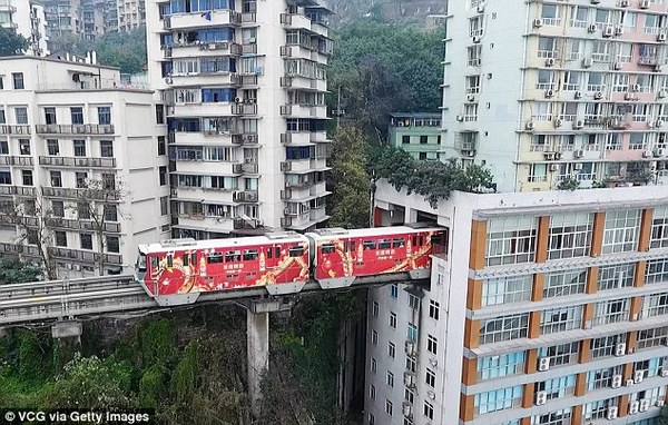 In China, a train passes right through a residential building - China, A train, Monorail, , Video, Longpost