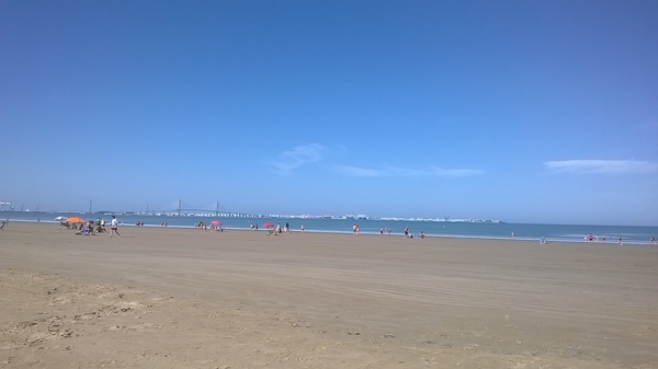 First time in the Atlantic Ocean. The city of Cadiz is visible in the distance. - Spain, Beach, Cadiz, Atlantic Ocean