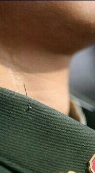 In China, in order for the military to keep their heads straight, a needle sticks out of their collars - Needle, Collar, China, Military