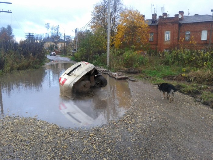 My Unpredictable City - Puddle, Road, Day