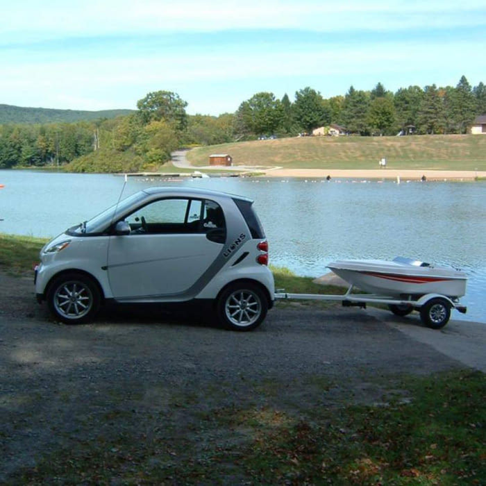 They say penis size is inversely proportional to car size... - Car, A boat, Penis