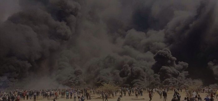 Clashes between the Palestinian Arabs of Gaza and the Israel Defense Forces during the march of return. Thousands of tires were set on fire. - Arabs, Israel, Collision, Smoke, Tires