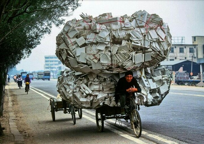 A man transports Styrofoam to be recycled in Guangzhou, a port city northwest of Hong Kong. - The photo, Styrofoam, Cool, Interesting, Photographer, China, Unusual, A bike