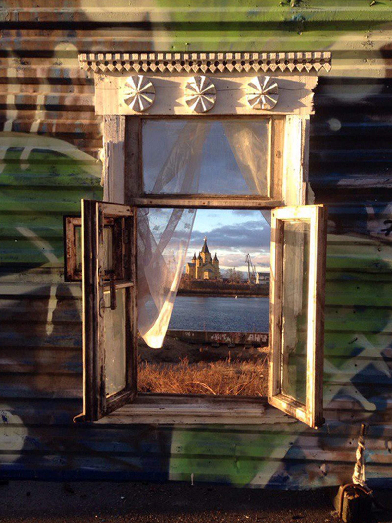 I inserted a window into the blue building fence on the Nizhny Novgorod embankment. - My, Window, , Nizhny Novgorod, Street art, Streetartnews, Russia today, Architecture, Russia, Longpost