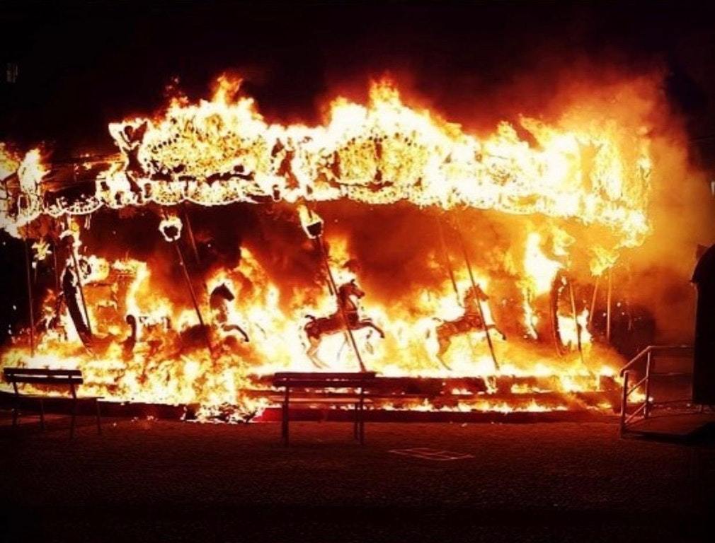 A friend of mine who lives in Italy sent me a photo of a carousel that caught fire in his city. It's creepy beautiful - Fire, Carousel, Italy, Reddit