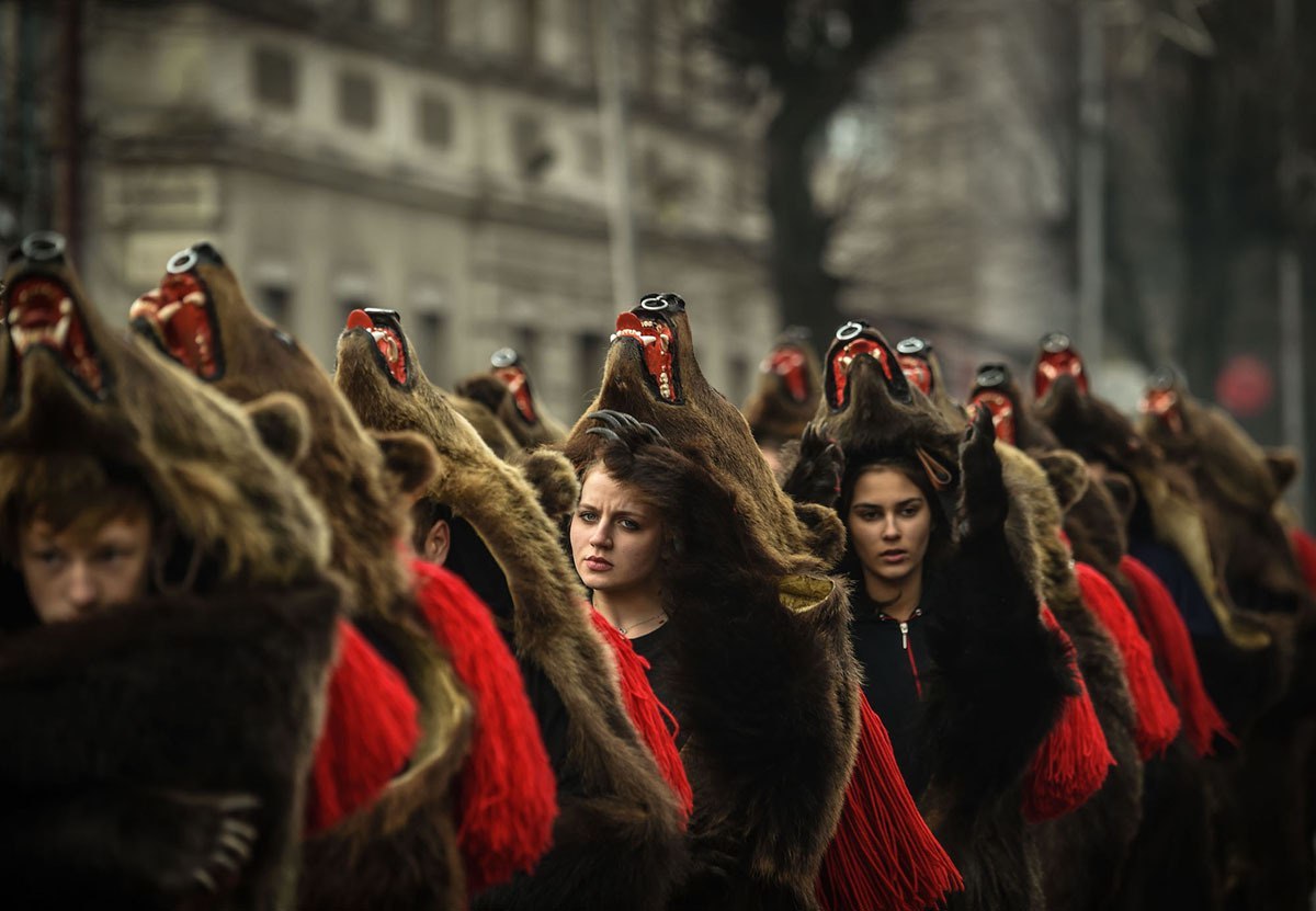 Traditional parade in bearskins of the inhabitants of the Romanian town of Comanesti - Girls, Brown bears, Parade, Romania, Longpost