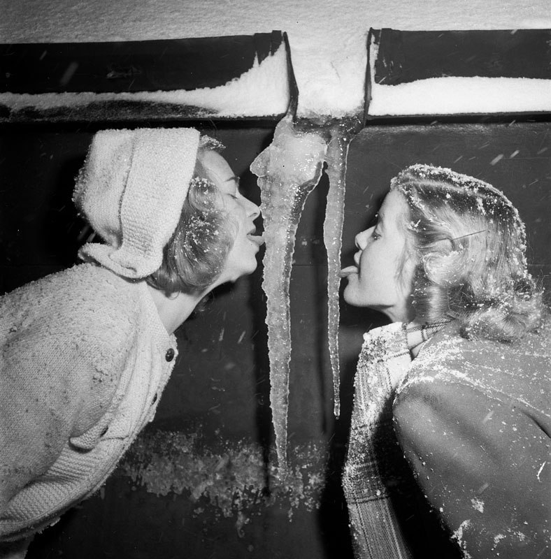 Two girls lick icicles. - Retro, Old photo