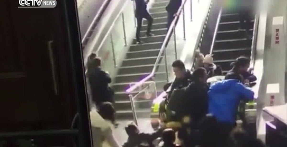 Clown Throwing Pie On Escalator