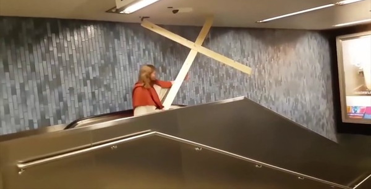 Clown Throwing Pie On Escalator